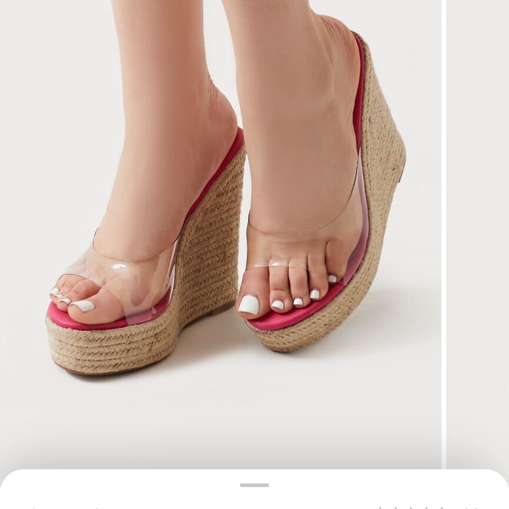 A pair of wedges featuring an open almond toe, clear vamp, platform,